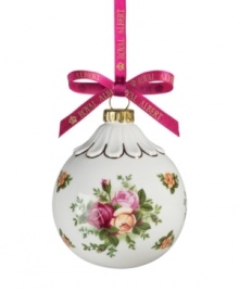 If you love it on your table, you'll adore it on the tree. This Old Country Roses ornament bears the classic pink and gold florals of Royal Albert's famed dinnerware collection in a scalloped ball shape.