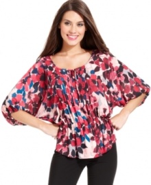 Alfani's pretty petite peasant top glows with a vibrant floral print and special details, like a pleated front placket. (Clearance) Alfani's pretty petite peasant top glows with a vibrant floral print and special details, like a pleated front placket. (Clearance)