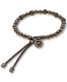 Delicious hues cover the beads on this stretch bracelet from Michael Kors. With a silk cord closure and MK logo charm. Crafted in espresso tone mixed metal. Bracelet stretches to fit wrist. Approximate diameter: 2-1/4 inches. Delicious hues cover the beads on this stretch bracelet from Michael Kors. With a silk cord closure and MK logo charm. Crafted in espresso tone mixed metal. Bracelet stretches to fit wrist. Approximate diameter: 2-1/4 inches.