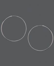 Thin is in! These skinny hoop earrings by Touch of Silver add a subtle touch to your look. Crafted in silver-plated brass with a sterling silver ear backing. Approximate diameter: 3 inches. Thin is in! These skinny hoop earrings by Touch of Silver add a subtle touch to your look. Crafted in silver-plated brass with a sterling silver ear backing. Approximate diameter: 3 inches.