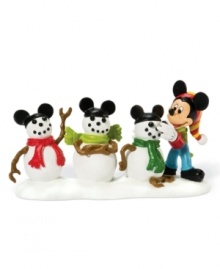 Mickey puts a Disney spin on three snowmen, crowning each with matching mouse ears. An irresistible winter scene, this Mickey's Village collectible figurine is perfect for a child's bedroom.