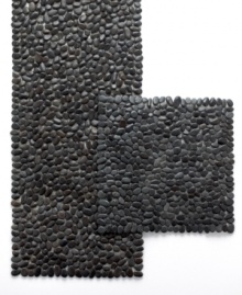 Rock out. The Beachstone placemat from Design Ideas has a serene sensibility yet striking impact on modern interiors. Glossy black stones affixed to transparent backing offer chic, textural contrast to minimalist place settings. (Clearance) Rock out. The Beachstone placemat from Design Ideas has a serene sensibility yet striking impact on modern interiors. Glossy black stones affixed to transparent backing offer chic, textural contrast to minimalist place settings. (Clearance)