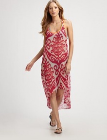 This voluminous, semi-sheer style features a bright ikat print and an asymmetrical hem. ScoopneckSleevelessRacerbackContrast pipingAsymmetrical hemAbout 50 from shoulder to hemPolyesterHand washMade in USA of imported fabrics This voluminous, semi-sheer style features a bright ikat print and an asymmetrical hem. ScoopneckSleevelessRacerbackContrast pipingAsymmetrical hemAbout 50 from shoulder to hemPolyesterHand washMade in USA of imported fabrics