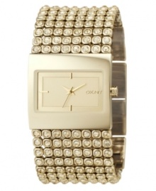 You'll love the luscious champagne-goldtone hue of this sparkling & glamorous watch by DKNY. Crystal-accented ion-plated goldtone stainless steel bracelet and rectangular case. Goldtone dial with stick indices and logo. Quartz movement. Water resistant to 30 meters. Two-year limited warranty. You'll love the luscious champagne-goldtone hue of this sparkling & glamorous watch by DKNY. Crystal-accented ion-plated goldtone stainless steel bracelet and rectangular case. Goldtone dial with stick indices and logo. Quartz movement. Water resistant to 30 meters. Two-year limited warranty.