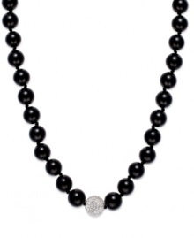A traditional style with sleek, modern appeal. This smooth strand showcases shiny onyx beads (10 mm) and a sparkling crystal ball at center (12 mm). Clasp crafted in sterling silver. Approximate length: 18 inches. A traditional style with sleek, modern appeal. This smooth strand showcases shiny onyx beads (10 mm) and a sparkling crystal ball at center (12 mm). Clasp crafted in sterling silver. Approximate length: 18 inches.