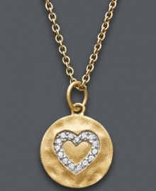 It's time to let love shine. Studio Silver's dazzling heart pendant features an imprinted crystal design set in 18k gold over sterling silver. Approximate length: 16 inches + 1-1/2-inch extender. Approximate drop: 3/4 inch. It's time to let love shine. Studio Silver's dazzling heart pendant features an imprinted crystal design set in 18k gold over sterling silver. Approximate length: 16 inches + 1-1/2-inch extender. Approximate drop: 3/4 inch.