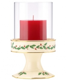 With bands of gold and a holly motif to match the beloved Holiday dinnerware pattern, this porcelain candle holder from Lenox creates instant Christmas ambiance. With red candle and glass shade. With bands of gold and a holly motif to match the beloved Holiday dinnerware pattern, this porcelain candle holder from Lenox creates instant Christmas ambiance. With red candle and glass shade.