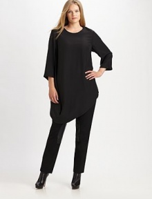 Made from sumptuous matte silk, a relaxed-fit top with a fashion-forward hem. Slim-fitting pants would look incredible with this design.Round neckSlit at three-quarter sleevesFrench dartsDraped hemAbout 35 from shoulder to hemSilkDry cleanImported