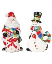 Savor every meal of the holiday season with Fitz and Floyd salt and pepper shakers. An especially jolly Santa and equally cheerful snowman don matching scarves and gifts for the table. Savor every meal of the holiday season with Fitz and Floyd salt and pepper shakers. An especially jolly Santa and equally cheerful snowman don matching scarves and gifts for the table.