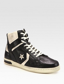 Slightly distressed leather high-top exudes a downtown-cool vibe with endless style possibilities.Leather upperLeather liningPadded insoleRubber soleImported