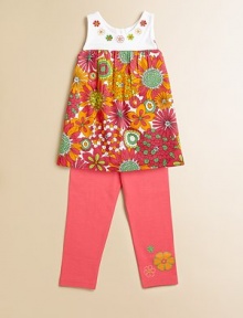 Groovy embroidered flowers and bold hues adorn this head-turning, empire-waist tunic for a 70's-inspired feel.ScoopneckSleevelessBack buttonsGathered empire waist95% cotton/5% spandexMachine washImported Please note: Number of buttons may vary depending on size ordered. Groovy embroidered flowers and bold hues adorn this head-turning, empire-waist tunic for a 70's-inspired feel.ScoopneckSleevelessBack buttonsGathered empire waist95% cotton/5% spandexMachine washImported Please note: Number of buttons may vary depending on size ordered.
