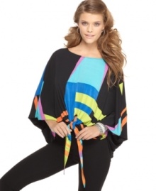 REIGN's printed top has a casual fit that is ultra-flattering. Pair it with jeggings for a silhouette that never goes out of style. REIGN's printed top has a casual fit that is ultra-flattering. Pair it with jeggings for a silhouette that never goes out of style.