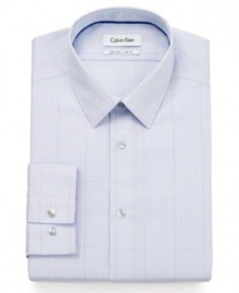 A classic checkered pattern gets a modern upgrade with this slim-fit, no-iron dress shirt from Calvin Klein. A classic checkered pattern gets a modern upgrade with this slim-fit, no-iron dress shirt from Calvin Klein.
