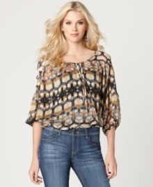 A little bit boho with a cool geometric print, this blouse by Kut from the Kloth is an instant classic!