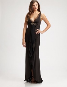 This sexy, satiny style exudes Old Hollywood glamour, and is finished with a sparkling beaded detail.V neckline with sheer trimSleevelessBeaded detailRuffled front drapeLow V back with concealed zipFully linedAbout 48 from natural waistPolyesterDry cleanMade in USA of imported fabricModel shown is 5'10 (177cm) wearing US size 4. This sexy, satiny style exudes Old Hollywood glamour, and is finished with a sparkling beaded detail.V neckline with sheer trimSleevelessBeaded detailRuffled front drapeLow V back with concealed zipFully linedAbout 48 from natural waistPolyesterDry cleanMade in USA of imported fabricModel shown is 5'10 (177cm) wearing US size 4.