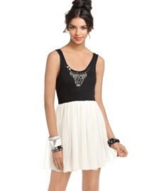 An embellished top and feather-light tulle skirt makes this dress from Tempted great for going out! Pair it with heels and stacked bracelets for a fun night with the girls!