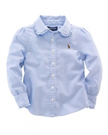 A preppy shirt in crisp cotton oxford is designed with stylish ruffles for a girlie look. A preppy shirt in crisp cotton oxford is designed with stylish ruffles for a girlie look.