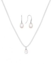 Casual chic. This pendant and earrings set from Majorica pops with organic man-made pearls (9 mm). The ivory-colored cord necklace adds a touch of whimsy. Crafted in silver tone mixed metal. Approximate length: 16 to 18 inches. Approximate drop: 1/2 inch. Casual chic. This pendant and earrings set from Majorica pops with organic man-made pearls (9 mm). The ivory-colored cord necklace adds a touch of whimsy. Crafted in silver tone mixed metal. Approximate length: 16 to 18 inches. Approximate drop: 1/2 inch.