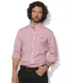 A polished stripe motif adds timeless style to a trim-fitting sport shirt in crisp cotton poplin.