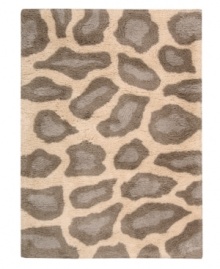 Exotic designs will be the pride of your decor. Adorned with leopard spots in soft beige, this Nourison rug has a marvelously soft and shaggy pile that's hand-tufted from premium-quality yarns. Beautiful in appearance and plush underfoot, this area rug creates an atmosphere of casual elegance. (Clearance) Exotic designs will be the pride of your decor. Adorned with leopard spots in soft beige, this Nourison rug has a marvelously soft and shaggy pile that's hand-tufted from premium-quality yarns. Beautiful in appearance and plush underfoot, this area rug creates an atmosphere of casual elegance. (Clearance)