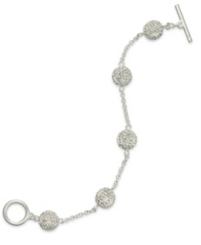 Live the glamorous life with this openwork illusion bracelet from Lauren by Ralph Lauren. Crafted from silver-tone mixed metal, the bracelet sparkles with pave glass accents. Approximate length: 7-1/2 inches.