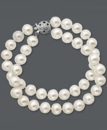 Decorate your wrists with not one, but two stands of sophisticated pearls. This shimmering bracelet features white cultured freshwater pearls (8 mm) and an elegant 14k white gold clasp. Approximate diameter: 3-1/2 inches. Approximate length: 7-1/2 inches. Decorate your wrists with not one, but two stands of sophisticated pearls. This shimmering bracelet features white cultured freshwater pearls (8 mm) and an elegant 14k white gold clasp. Approximate diameter: 3-1/2 inches. Approximate length: 7-1/2 inches.