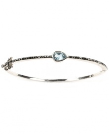 Layer-able style that adds a touch of shimmer. Judith Jack's thin, stackable bangle features a pear-cut blue topaz (1/4 ct. t.w.) and glittering marcasite in sterling silver. Approximate diameter: 2-3/8 inches.