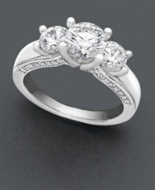 Complete the moment. A breathtaking round-cut solitaire diamond (1 ct. t.w.) with accompanying side diamonds (3/8 ct. t.w.) will be her most-prized possession. A unique engagement ring that features a special side design with diamond accents along the profile of the band. Ring crafted in 18k white gold. IGI Certified diamonds. Complete the moment. A breathtaking round-cut solitaire diamond (1 ct. t.w.) with accompanying side diamonds (3/8 ct. t.w.) will be her most-prized possession. A unique engagement ring that features a special side design with diamond accents along the profile of the band. Ring crafted in 18k white gold. IGI Certified diamonds.