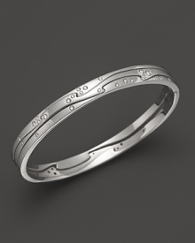 Scattered diamonds sparkle on this modern white gold bangle from Georg Jensen. Scattered diamonds sparkle on this modern white gold bangle from Georg Jensen.