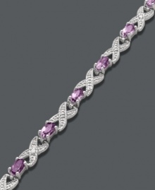 Regally stylish. Victoria Townsend's unique crisscross bracelet incorporates oval-cut amethyst (3 ct. t.w.) and sparkling diamond accents. Crafted in sterling silver. Approximate length: 7-1/4 inches. Regally stylish. Victoria Townsend's unique crisscross bracelet incorporates oval-cut amethyst (3 ct. t.w.) and sparkling diamond accents. Crafted in sterling silver. Approximate length: 7-1/4 inches.