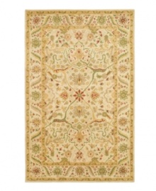 Enjoy a thousand years of rug-making tradition -- set against a soft ivory ground -- with this striking area rug from Safavieh. Tufted in India from pure wool, this rug emerges from the annals of antiquity to bring spectacular style and time-honored quality to your home. (Clearance)