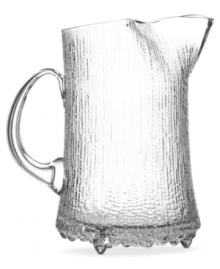 A testament to winter's beauty, the Ultima Thule pitcher features distinctive shaping and texture inspired by melting ice and designed by Tapio Wirkkala. Originally crafted using a wooden mold, each piece in the Iittala collection reflects thousands of hours of glass blowing technique. A testament to winter's beauty, the Ultima Thule pitcher features distinctive shaping and texture inspired by melting ice and designed by Tapio Wirkkala. Originally crafted using a wooden mold, each piece in the Iittala collection reflects thousands of hours of glass blowing technique.