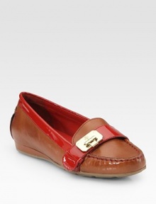 Moccasin-inspired leather with vibrant patent leather trim and a unique, hinge-adorned buckle strap. Leather and patent leather upperLeather liningRubber solePadded insoleImportedOUR FIT MODEL RECOMMENDS ordering one half size down as this style runs large. Moccasin-inspired leather with vibrant patent leather trim and a unique, hinge-adorned buckle strap. Leather and patent leather upperLeather liningRubber solePadded insoleImportedOUR FIT MODEL RECOMMENDS ordering one half size down as this style runs large.
