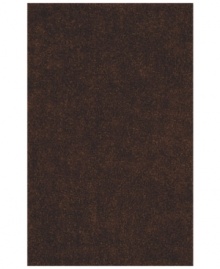 Add rich, shimmering chocolate tones to any modern room with the Metallic area rug from Dalyn. Hand-tufted of soft polyester, this high-luster shag area rug puts comfort and fun back in floor decor.