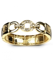 Golden rules. Featuring the brand's signature lion logo, AK Anne Klein's stretch bracelet will stand out as a stylish addition to your wardrobe. Made in gold tone mixed metal with black overlay, the stretch design lets it slip on and off the wrist with grace and ease. Approximate diameter: 2-1/4 inches.