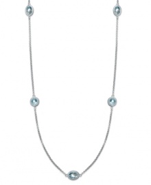 Long and luxurious. This pretty strand necklace features round and oval-cut stations of blue topaz (12 ct. t.w.) on a delicate sterling silver chain. Approximate length: 36 inches. Long and luxurious. This pretty strand necklace features round and oval-cut stations of blue topaz (12 ct. t.w.) on a delicate sterling silver chain. Approximate length: 36 inches.