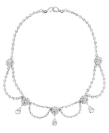 Definitively dazzling. Embellished with glittering Swarovski crystals, you'll make an elegant entrance in this striking swag collar necklace from Monet. Crafted in silver tone mixed metal. Approximate length: 17 inches.