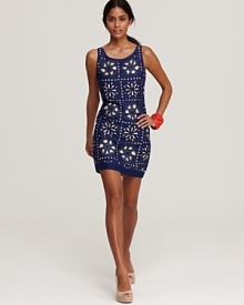 Cut-out floral designs bloom on this delightful KASNew York dress, complete with a sunny yellow underlay. Wear it with espadrilles and bright bangles for a feminine resort-ready look. Cut-out floral designs bloom on this delightful KASNew York dress, complete with a sunny yellow underlay. Wear it with espadrilles and bright bangles for a feminine resort-ready look.
