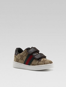 Double strap design in GG fabric and leather with signature web detail and cozy rubber sole.Adjustable double grip-tape hook-and-loop strap closureGG fabric and leather upperRubber solePadded insoleMade in Italy Double strap design in GG fabric and leather with signature web detail and cozy rubber sole.Adjustable double grip-tape hook-and-loop strap closureGG fabric and leather upperRubber solePadded insoleMade in Italy