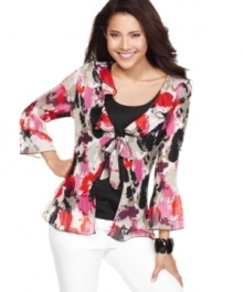 Add boho-chic flair to your wardrobe with Style&co.'s petite tunic top! The split cuffs and textured fabric give this piece subtle and appealing detail. Add boho-chic flair to your wardrobe with Style&co.'s petite tunic top! The split cuffs and textured fabric give this piece subtle and appealing detail.