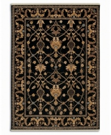 Graceful gold-beige designs add magnetic appeal to this deep-black area rug. Karastan's signature luster-wash gives the piece an exceptionally soft hand, while also enhancing the richness of the colors. Woven from plush New Zealand wool. Cotton foundation.