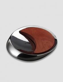Inspired by the meeting of the sun and moon, this innovative metal alloy and cherry wood design combines a bowl and a board for both cutting and serving. Comes in Nambé blue gift box 14 Dia Hand wash gently Imported Inspired by the meeting of the sun and moon, this innovative metal alloy and cherry wood design combines a bowl and a board for both cutting and serving. Comes in Nambé blue gift box 14 Dia Hand wash gently Imported