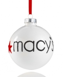 Find your holiday magic at Macy's with this simple ball ornament, featuring radiant white glass with glittery embellishment.