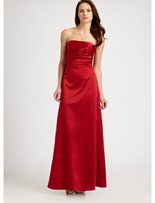 Long and elegant, this strapless design is softened with side ruching. Back zipper with hook and eye closure Fully lined About 43½ from natural waist Perfect for bridesmaids Polyester; dry clean Made in USAOUR FIT MODEL RECOMMENDS ordering true size.. 