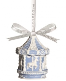 Fill your child's first Christmas with the understated grace of Wedgwood's carousel ornament. Embossed horses and garland in crisp white contrast cool blue porcelain. Dated 2012.