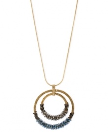 Expand your inner circle with an outer one, too. This double pendant from Kenneth Cole New York is crafted from gold-tone mixed metal and adorned with silver-colored and blue faceted beads for a pop of color. Approximate length: 32 inches + 3-inch extender. Approximate drop: 2-3/4 inches.