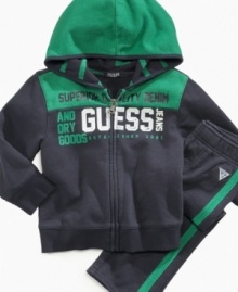 Keep him motivated to move in this comfortable hoodie and pant set from Guess.