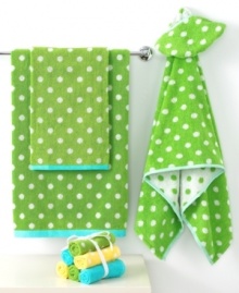 Hop to it! This cheerful Froggy bath towel makes bath time a time for smiles in pure cotton. Its green terry jacquard weave with white polka dots features a cool blue border. Hop to it! This cheerful Froggy bath towel makes bath time a time for smiles in pure cotton. Its green terry jacquard weave with white polka dots features a cool blue border.
