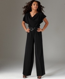This breezy, blousy petite jumpsuit by AGB features a relaxed stretch fit and a nipped belted waist to create a feminine silhouette. This breezy, blousy petite jumpsuit by AGB features a relaxed stretch fit and a nipped belted waist to create a feminine silhouette.