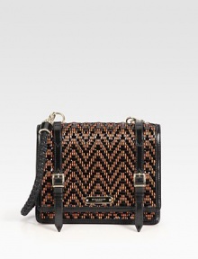 The structured satchel crafted from woven chevron stripes of sleek patent leather and contrast yarn, adorned with front buckled straps.Braided top handle, 11 dropFlap snap closureOne inside zip pocketOne inside open pocketLeather lining9W X 7½H X 2¾DImported The structured satchel crafted from woven chevron stripes of sleek patent leather and contrast yarn, adorned with front buckled straps.Braided top handle, 11 dropFlap snap closureOne inside zip pocketOne inside open pocketLeather lining9W X 7½H X 2¾DImported